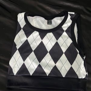 black & white shirt that looks like a vest.
